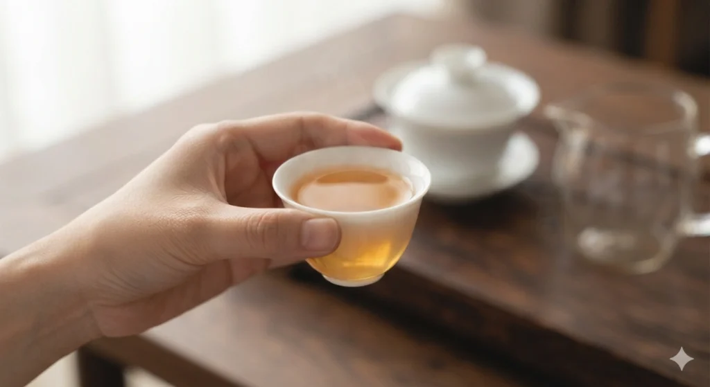 Mindful moment enjoying a cup of brewed Dancong tea