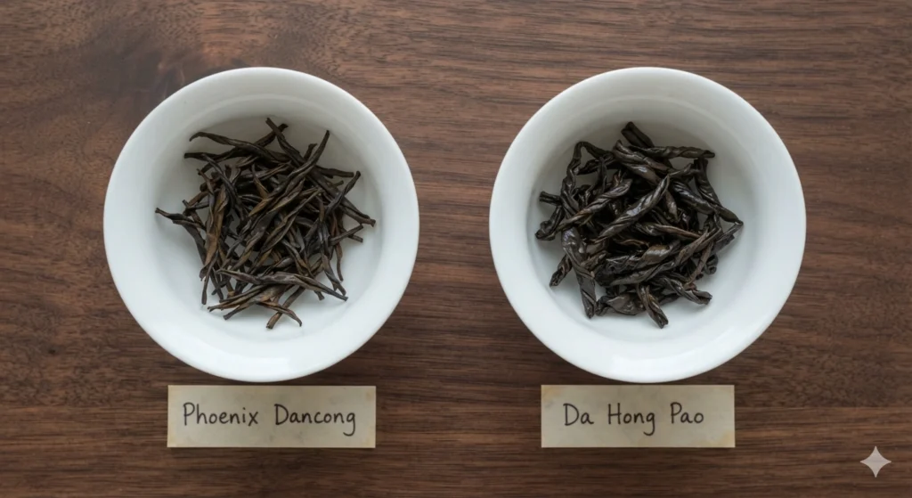 Phoenix Dancong vs Da Hong Pao dry tea leaves comparison flat lay